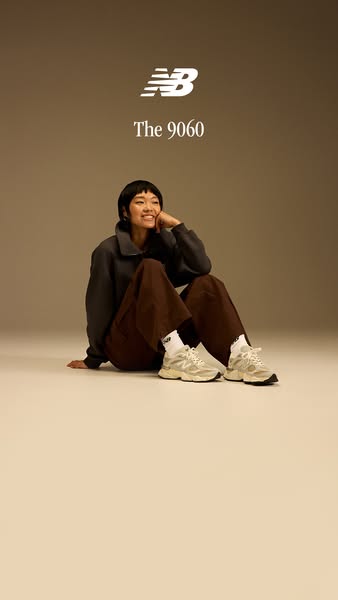 This ad showcases the New Balance 9060 sneakers. The ad features a person sitting on the floor wearing the sneakers.