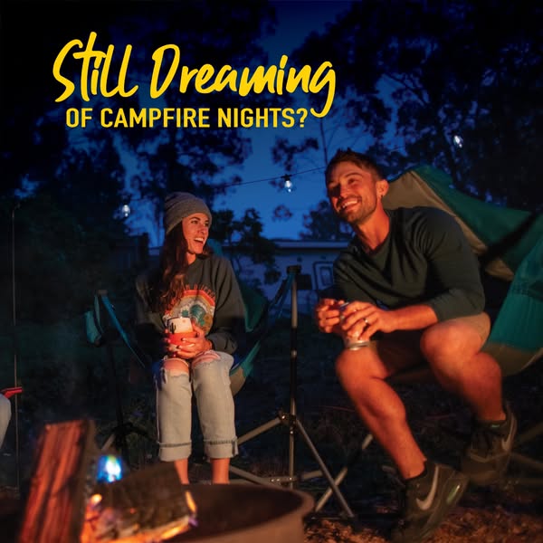 This image ad features a couple sitting around a campfire and includes the question, "Still Dreaming of CAMPFIRE NI