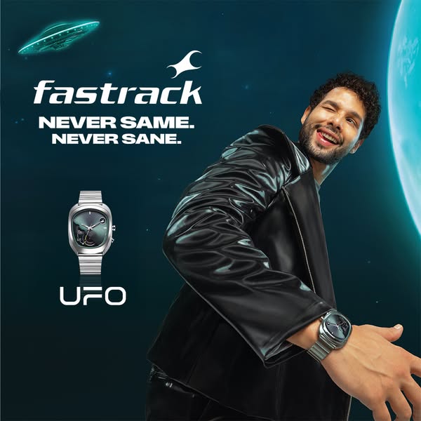 This image ad shows a Fastrack UFO watch being worn by a man in a black leather jacket. The background features an outer