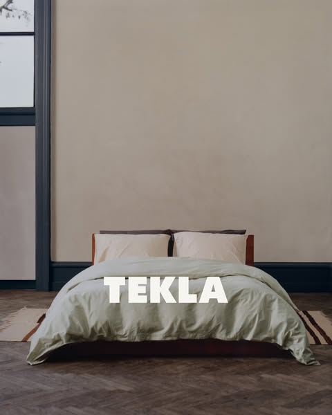 This ad showcases a bedroom set from Tekla. The scene features the bed with bedsheets and pillow covers. The ad is desig