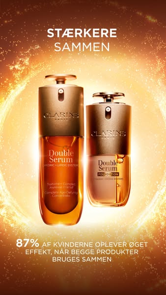 An image ad for Clarins products. Two bottles, Double Serum and Double Serum Foundation, are displayed against a gold, b
