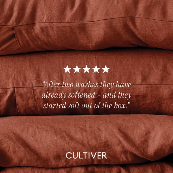 This ad features a close-up image of neatly stacked linen bedding. A glowing five-star rating and a quote praising the s