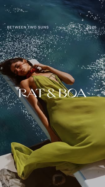 This ad features a woman lounging near sparkling water wearing a long olive-green dress from Between Two Suns SS26 colle