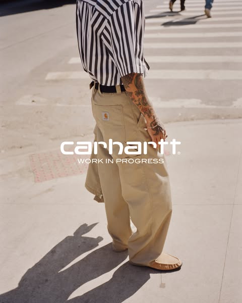 This ad features a photo of a person wearing Carhartt Work In Progress pants and shoes, emphasizing the brand's casu