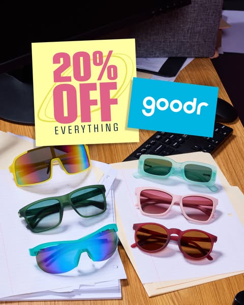 The ad displays five pairs of Goodr sunglasses arranged on a stack of papers. A yellow square announces a 20% off everyt