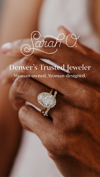 This ad features a close-up view of a hand wearing two diamond rings from Sarah O. Jewelry. The ad is designed to resona