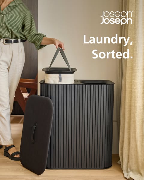 This ad showcases a laundry sorting bin from Joseph Joseph. The visual focuses on its modern design, functionality, and 