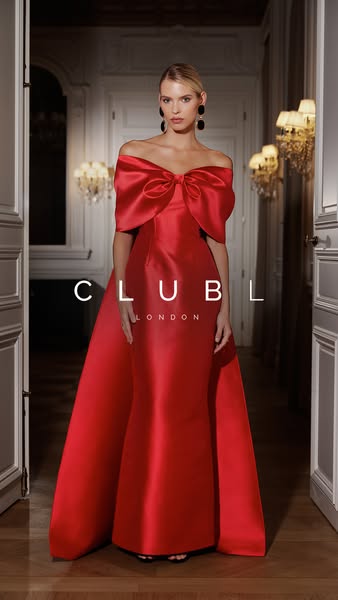 This ad features a model in a red satin dress with the Club L London logo.