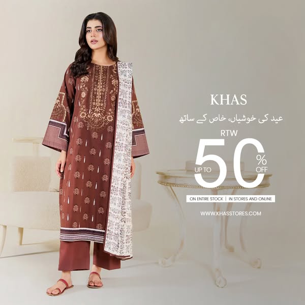 Image ad for KHAS featuring a woman modeling a brown patterned dress with a white patterned dupatta, accompanied by a di