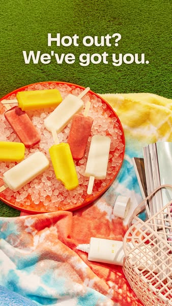 This image ad for sunscreen mimics a summer day at the beach or pool. It shows an aesthetic arrangement of popsicles, a 