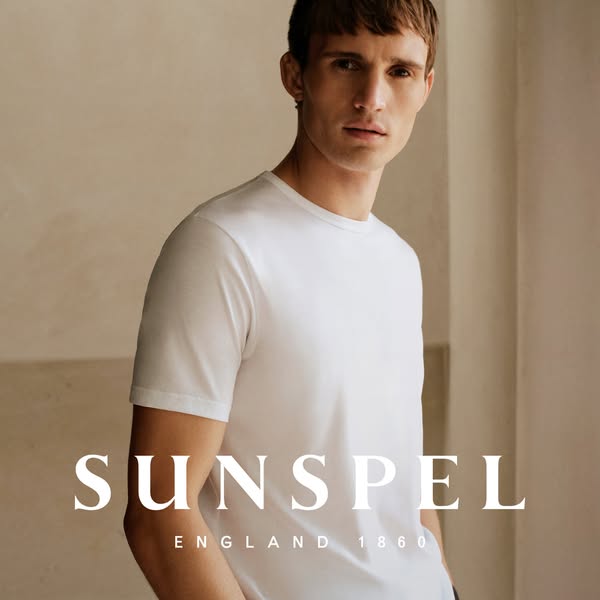 This image ad showcases a man wearing a Sunspel white t-shirt. The ad emphasizes the brand name and its heritage, with t