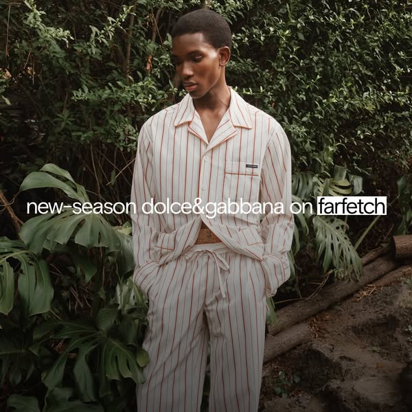 This ad showcases new-season Dolce & Gabbana clothing available at Farfetch, presented in a high-fashion editorial s