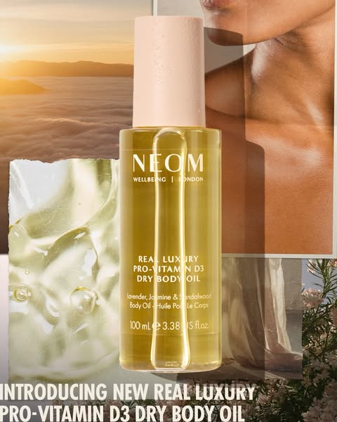 This ad promotes NEOM's Real Luxury Pro-Vitamin D3 Dry Body Oil. The image features the product prominently against 