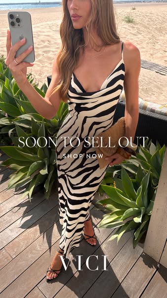 This image ad for VICI promotes a zebra-print dress that is expected to sell out quickly. It features a model taking a s