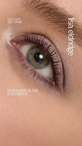 Close up shot of a woman's eye with purple eyeshadow and eyeliner. The ad is highlighting a new shade of eye pencil.