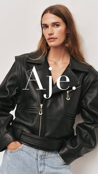 This ad features a woman wearing a black leather jacket and light wash jeans. The brand name is displayed prominently ov