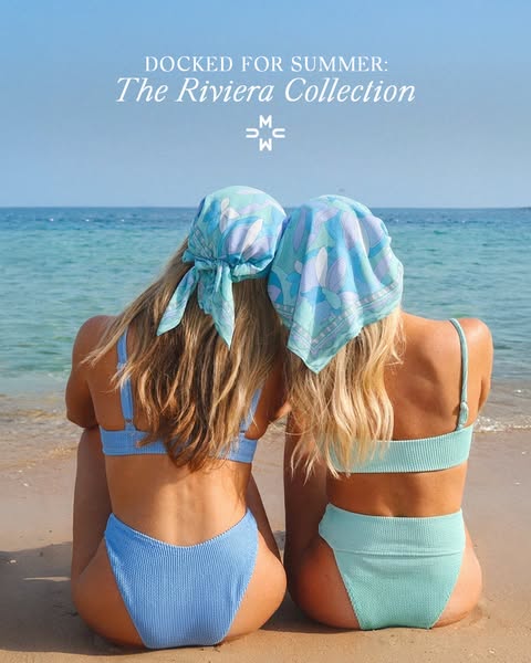 An image featuring two women on a beach, wearing swimsuits and headscarves from the Riviera collection.