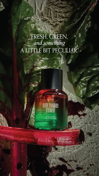Image ad featuring the Rhubarb Thief perfume by Heretic Parfum. The ad uses fresh rhubarb as a prop, visually connecting
