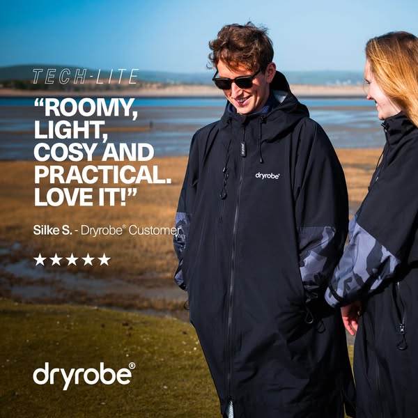 This image ad features a testimonial for Dryrobe's TECH-LITE product, showing two models on a beach wearing the robe