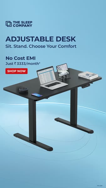 This image ad showcases an adjustable desk from The Sleep Company. The ad highlights the desk's sit-stand functional