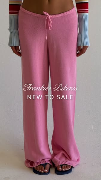 This image ad for Frankies Bikinis features a woman wearing a pair of pink knit pants. The text overlay announces the pr