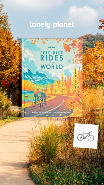 This ad for Lonely Planet's Epic Bike Rides of the World book features the book standing upright on a walking path s