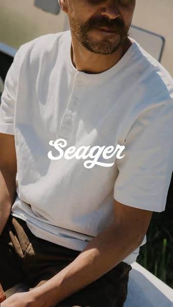This ad features a close-up shot of a man wearing a Seager shirt. The shot focuses on the upper torso, emphasizing the s