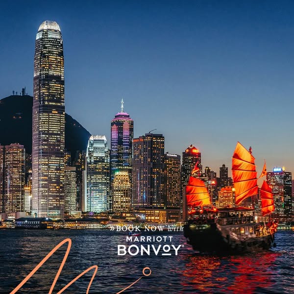 This image ad showcases the Marriott Bonvoy brand against the backdrop of the Hong Kong skyline at night. The ad emphasi