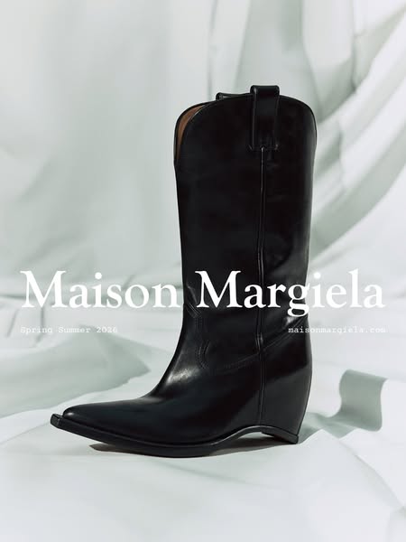 This ad showcases a single black cowboy boot by Maison Margiela in a studio setting.