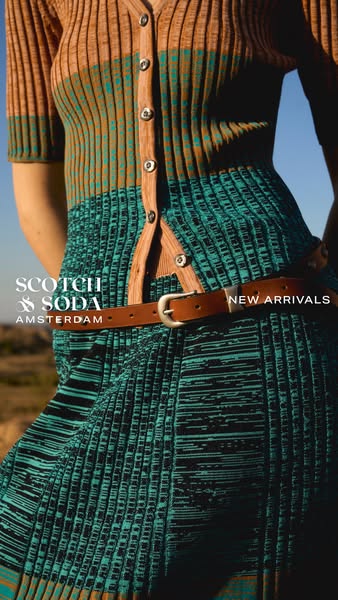 This Scotch & Soda image ad features a model wearing a brown and green dress with a brown belt. The ad also promotes