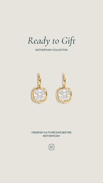 This image ad is advertising jewelry from the brand K. It features a pair of earrings and promotes its Mother's Day