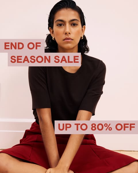 The ad features a woman in a dark brown short-sleeve shirt and a red skirt, promoting an end-of-season sale with discoun