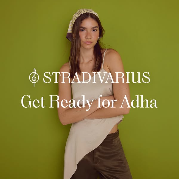 This ad features a young woman in a cream colored shirt and brown pants against a green background with the brand name a