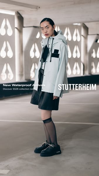 An image ad promoting Stutterheim's new waterproof arrivals. The ad features a model in a light blue waterproof coat