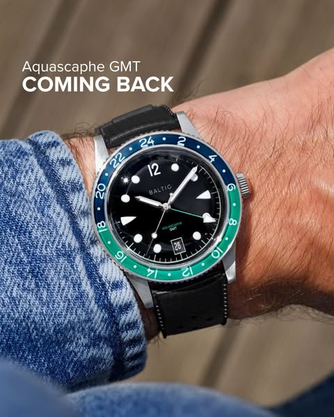 This image ad features the Baltic Aquascaphe GMT watch on a person's wrist, set against a blurred wooden background.