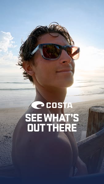 This Costa ad features a medium shot of a man wearing sunglasses on a beach, looking upward toward the sunlight. The bra
