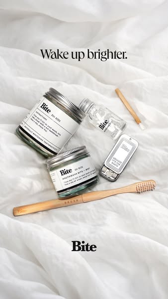 This ad is for Bite brand oral care products. The ad shows several Bite products on a white bed sheet, and prompts the v