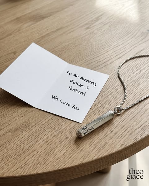 Image ad for Theo & Grace jewelry showing a personalized pendant and an accompanying card. The ad is aimed at spouse