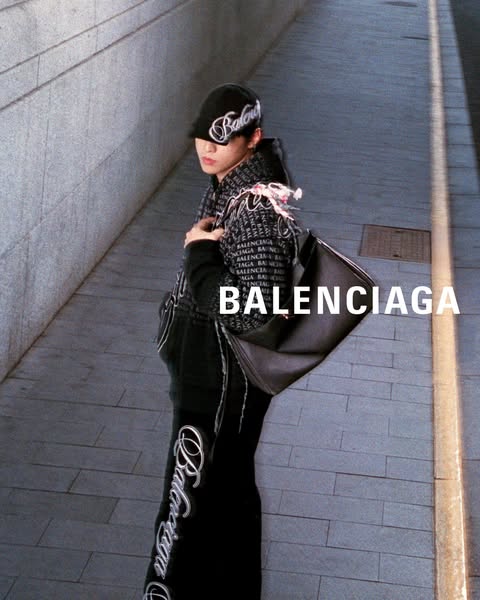 This ad showcases Balenciaga apparel and accessories, emphasizing the brand's name and logo through repeated pattern