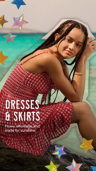 This image ad features a model wearing a red and white gingham dress next to a body of water. The ad promotes dresses an