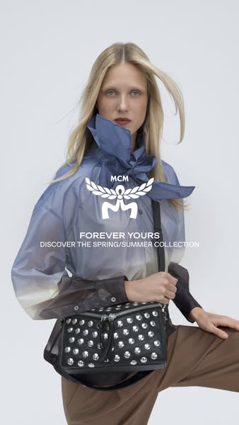 This ad showcases a person wearing a jacket and displaying a MCM bag. The call to action is to discover the spring/summe