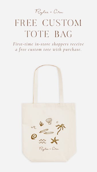 The ad promotes Rylee + Cru by offering a free custom tote bag for first-time in-store shoppers with a purchase.