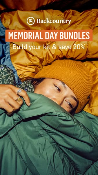 This ad for Backcountry promotes a Memorial Day sale on bundled products. The image features a woman in a sleeping bag, 