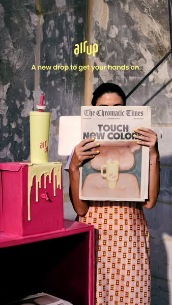 A hip ad for a new flavor release from air up. A woman holds a newspaper that is covering her face and the headline read