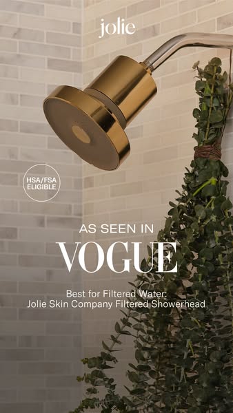 Ad for Jolie Skin Company Filtered Showerhead features a gold showerhead in a shower. The showerhead is tagged as being 