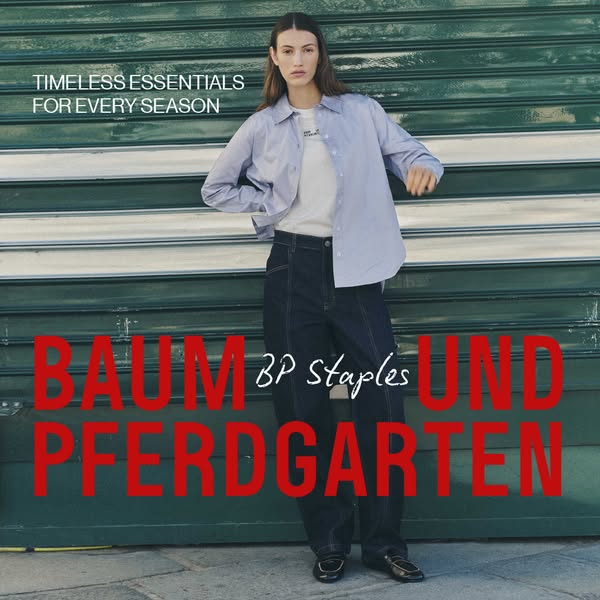 This ad for Baum Und Pferdgarten features a model wearing several items from the BP Staples collection. It is set agains