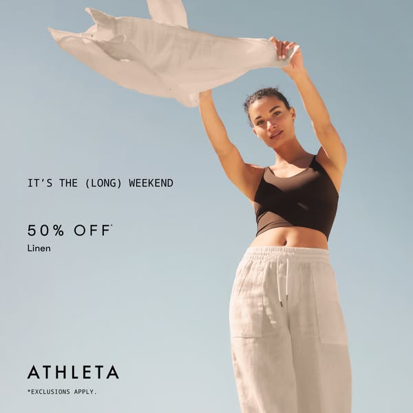 An ad promoting 50% off linen clothing from Athleta during a long weekend, featuring a woman outdoors wearing linen pant