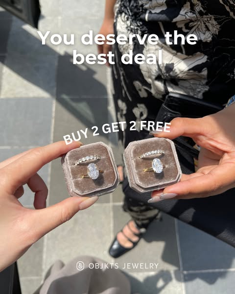 This ad features two small jewelry boxes each holding a ring set (a diamond band and an oval solitaire) with the copy &#