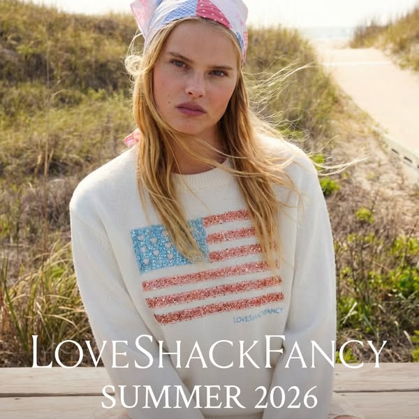 This image ad showcases LoveShackFancy's Summer 2026 collection, featuring a woman wearing a white sweater with an A