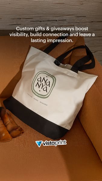 This Vistaprint ad showcases a custom tote bag with a company logo printed on it. The ad aims to highlight the benefits 